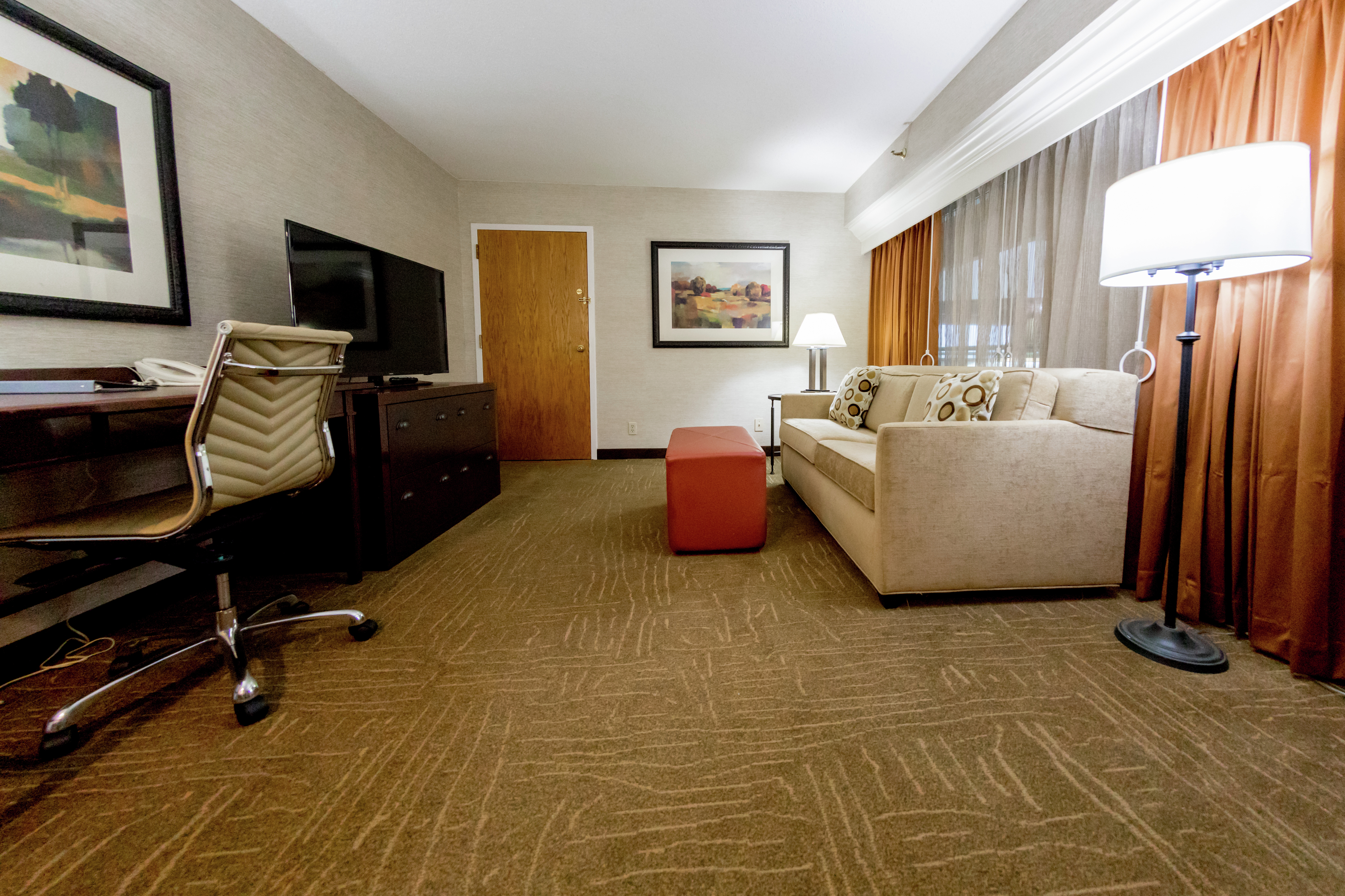 Accessible Guestroom Parlor with Work Desk, Lounge Area, and Room Technology