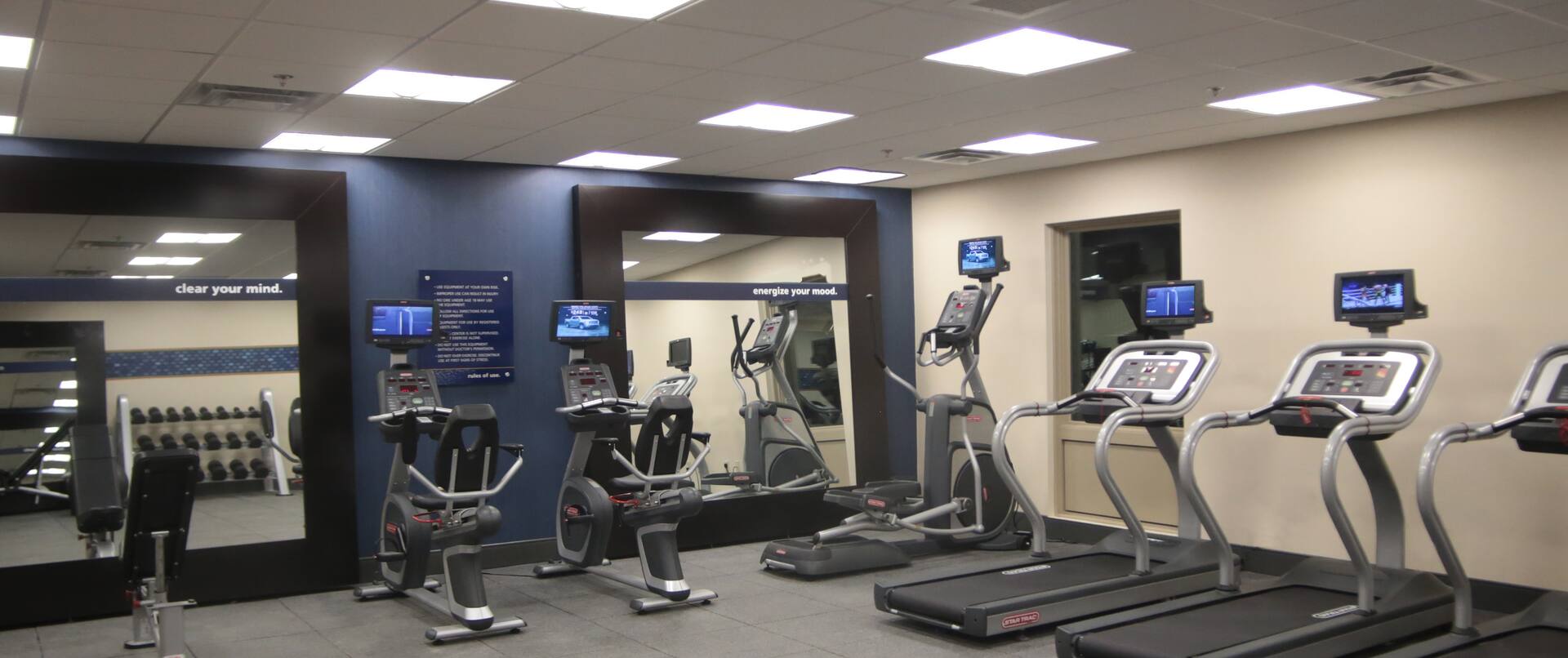 Fitness Center With Large Mirrors, and Cardio Equipment