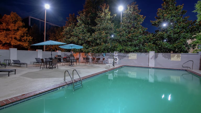 Outdoor Pool and Patio Seating at Night