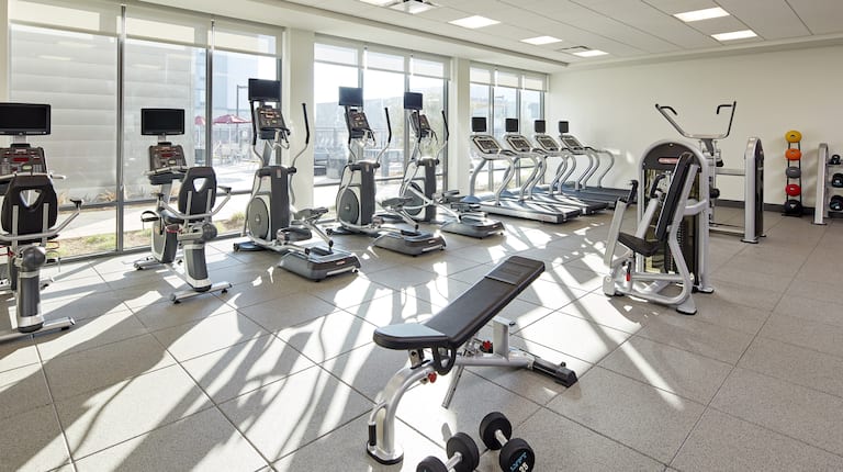 Fitness Center with Cardio Equipment and Weight Bench
