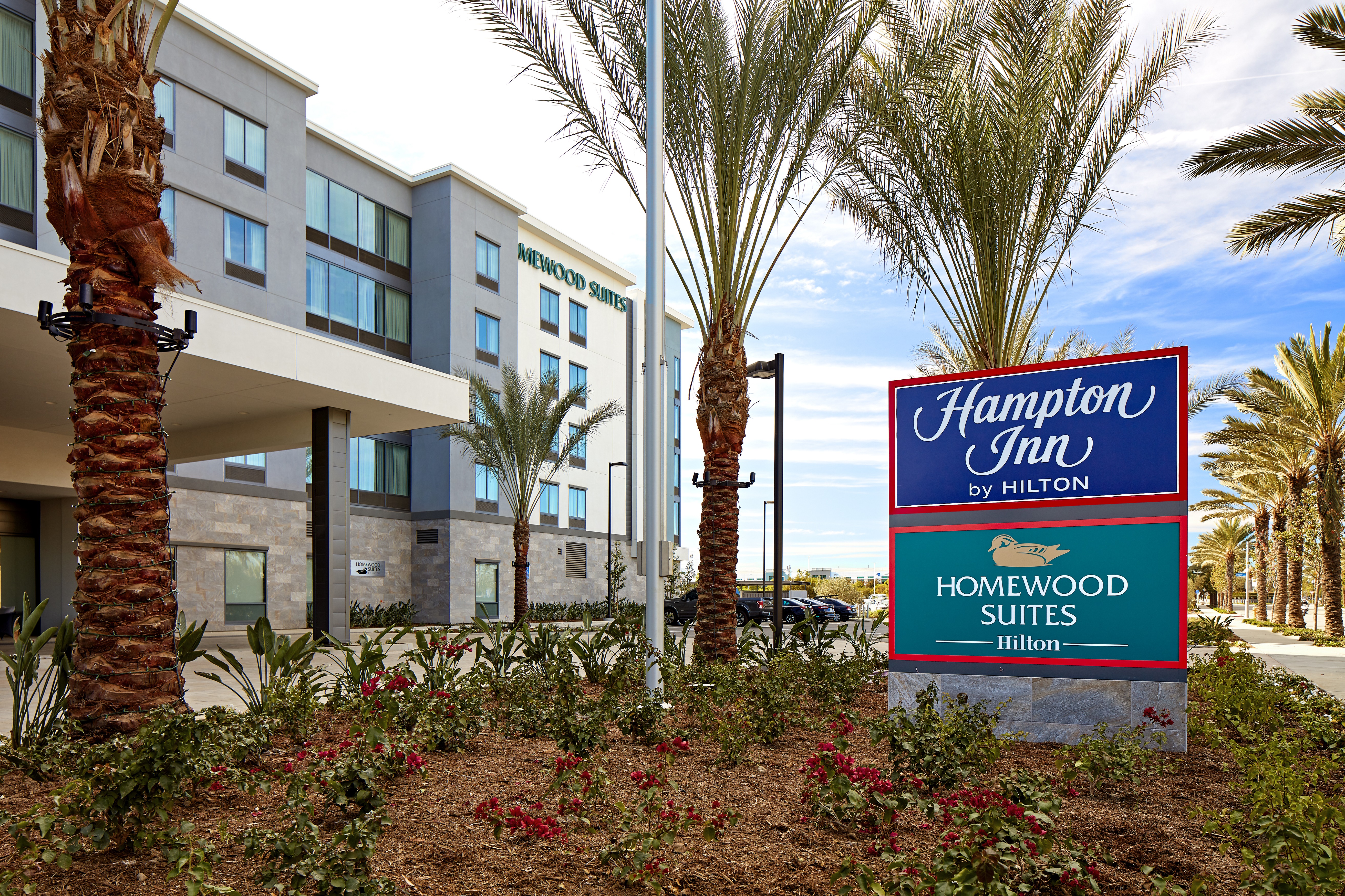 Hotel Building Exterior Front with Hamption Inn and Homewood Suites Signs