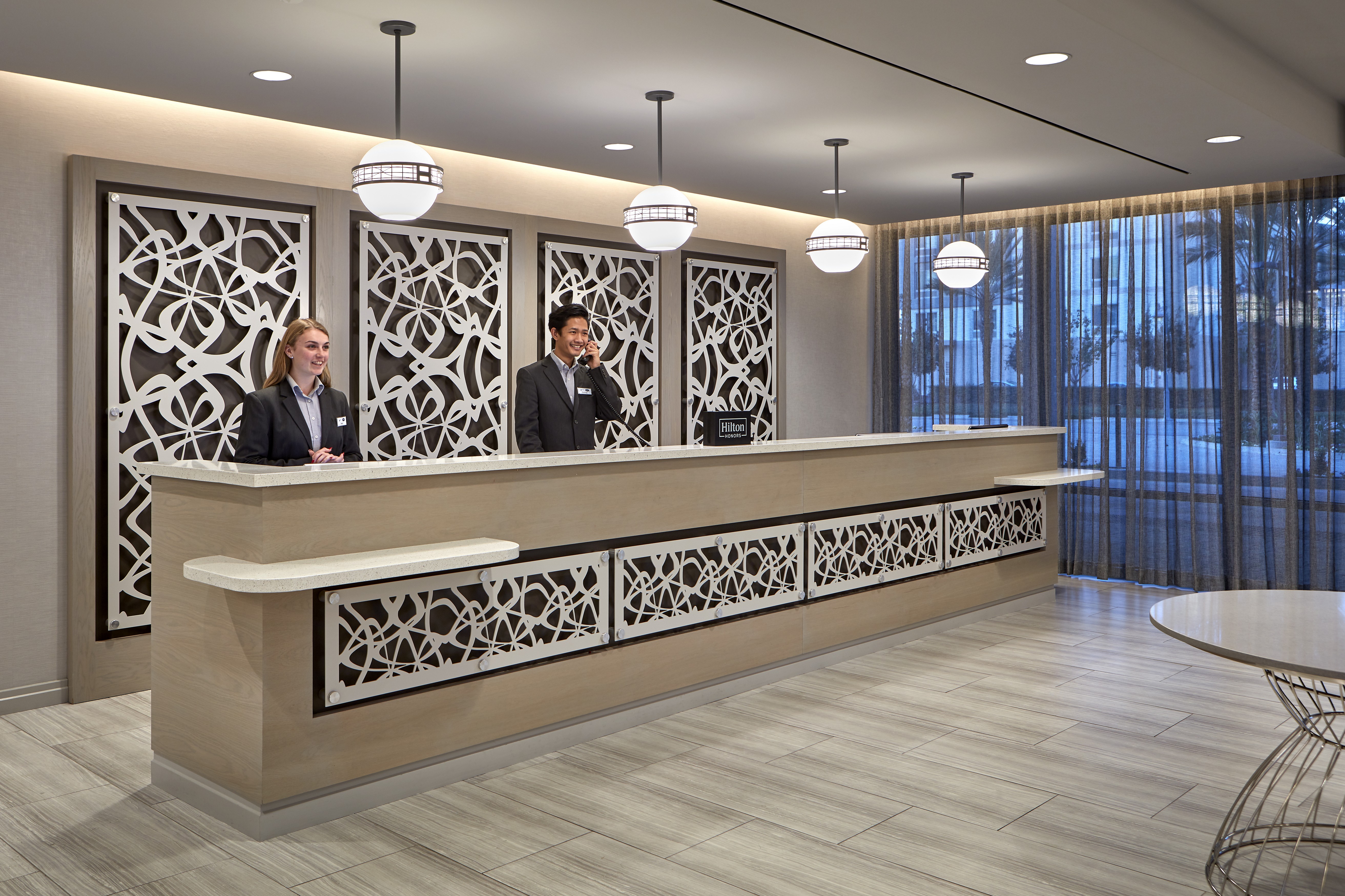 Front Desk Reception Area with Two Front Desk Staff Members