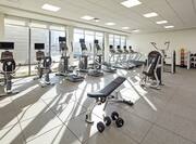 Fitness Center with Cardio Equipment and Weight Bench