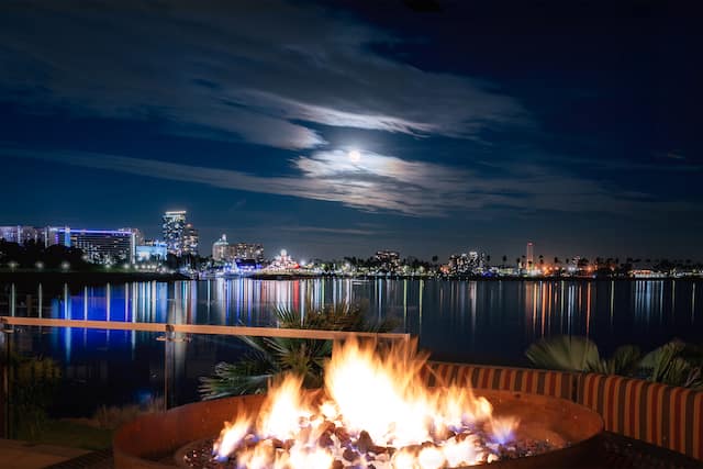outdoor patio, fire pit, view of the water