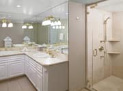Presidential Suite Bathroom with Dual Vanity and Glass Door Shower
