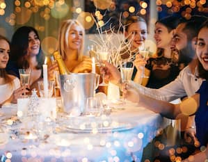 People toasting around holiday table