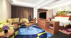 Suite with King Bed, Lounge Seating, Work Desk, and Flat Screen TV
