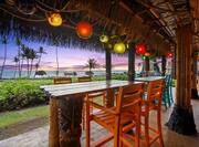 Dining Area of Mamahunes Tiki Bar at Sunset
