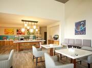 Dining Tables and Buffet Items in Breakfast Area With Wall Art