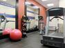 Fitness center with treadmill, elliptical, and exercise balls