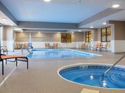 Indoor whirlpool and pool with lounge chairs