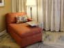 Guestroom lounge chair with floor lamp