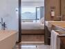 View of Bathtub and Bed in Guest Room with View of the Mountains