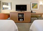 Desk Microwave Coffeemaker and HDTV in Hotel Guest Room with Two Beds
