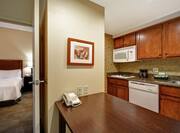 One Bedroom Suite Kitchen and Dining Table