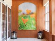 Lobby Entrance Art on Orange Wall With Windows and Lanterns with Candles Inside