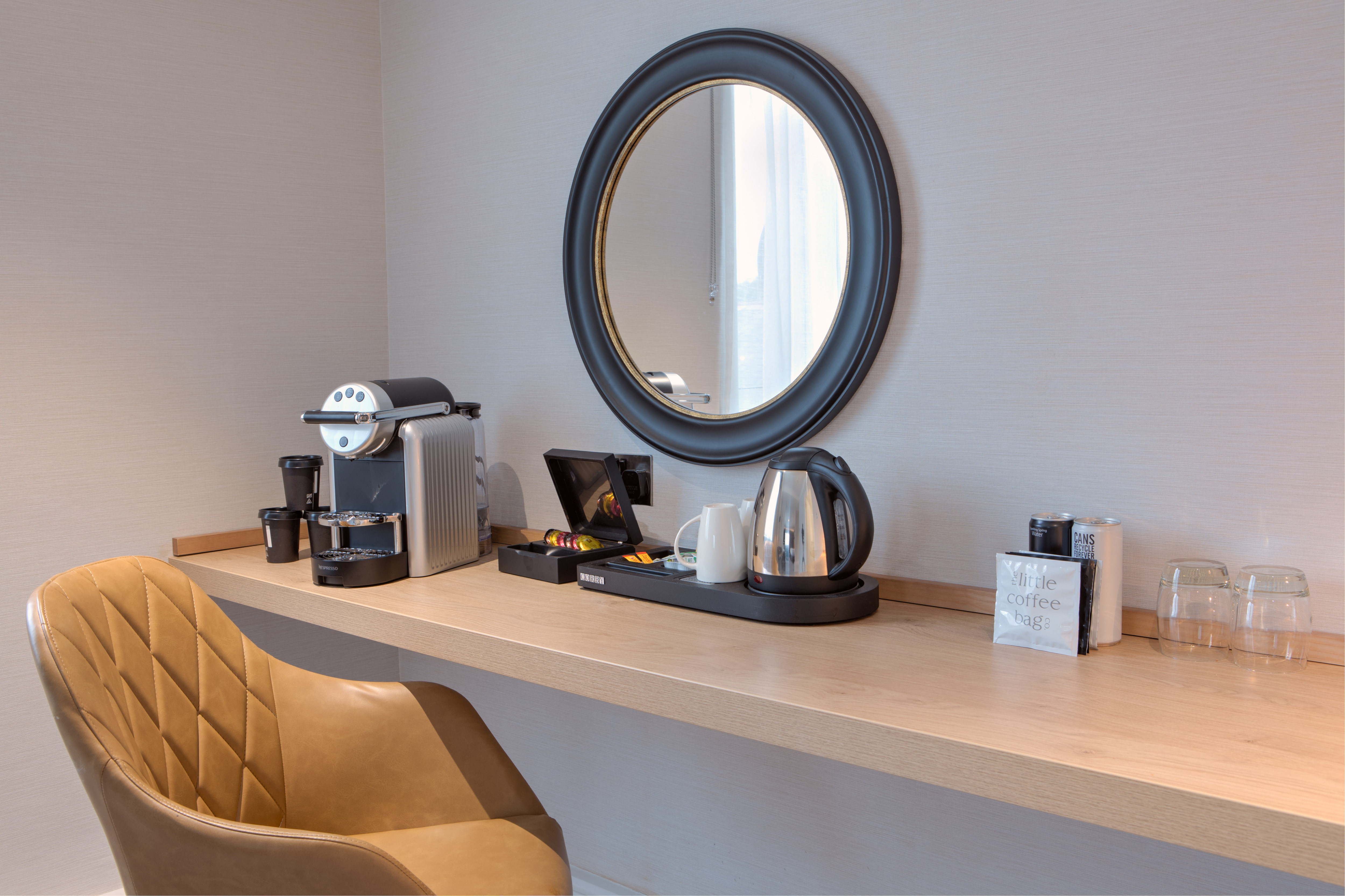Desk Coffeemaker and Mirror in Guest Room