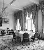 Ballroom table set up with extravagant drapes 