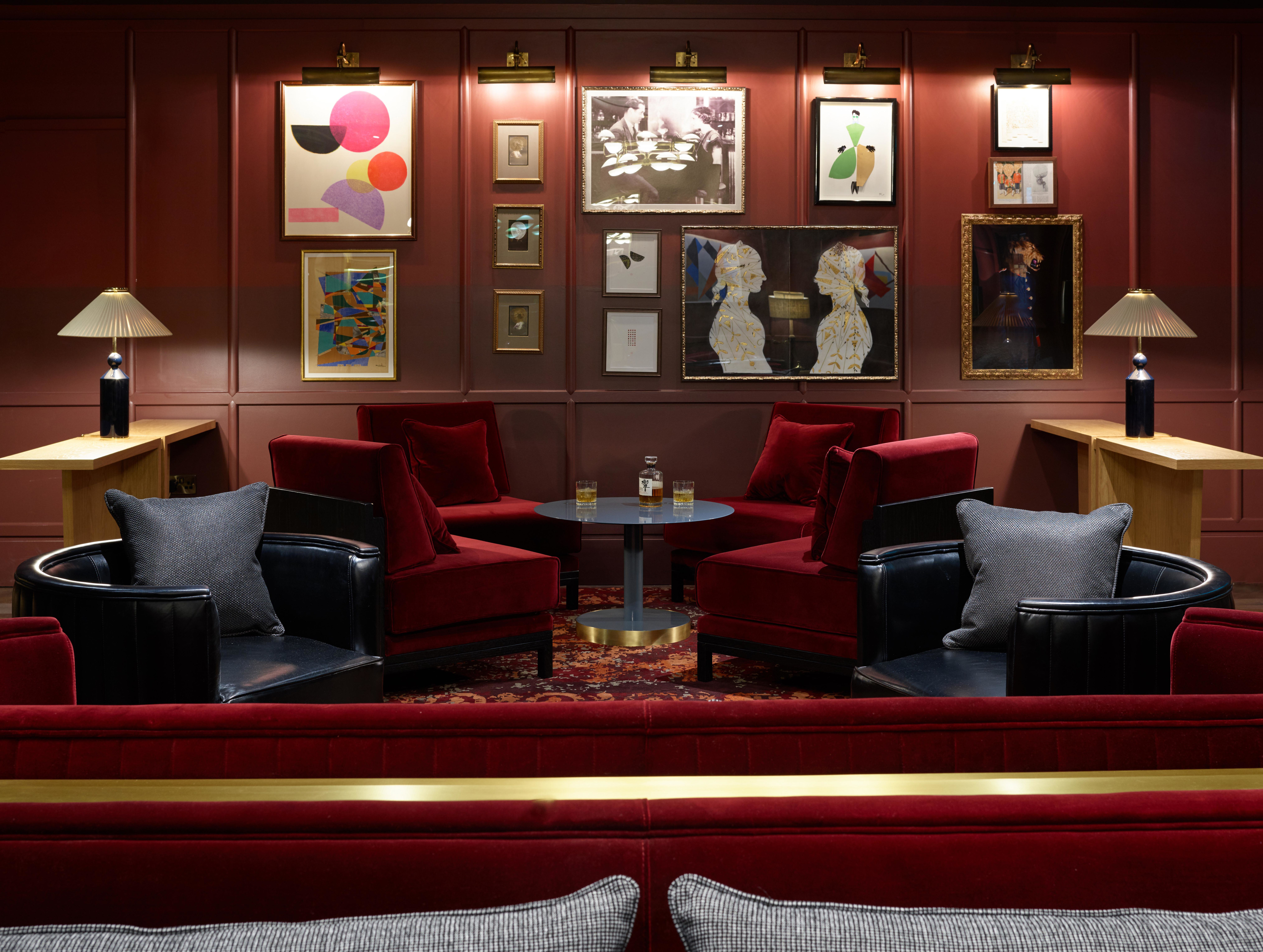 Cocktail lounge in restaurant with soft chairs,coffee table, and art on the wall