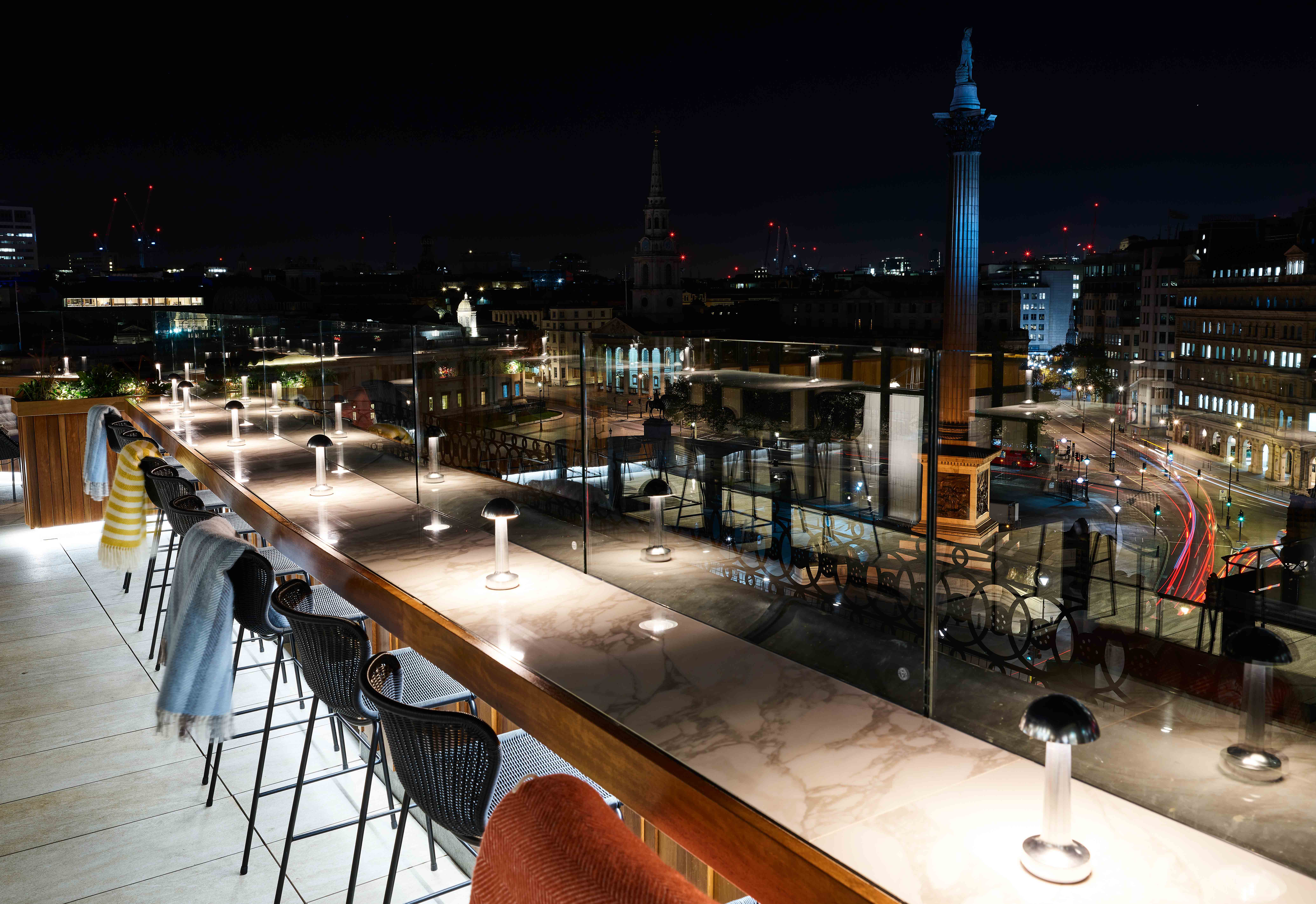 Rooftop bar with city view at night