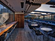 The Rooftop restaurant with open ceiling at sunset