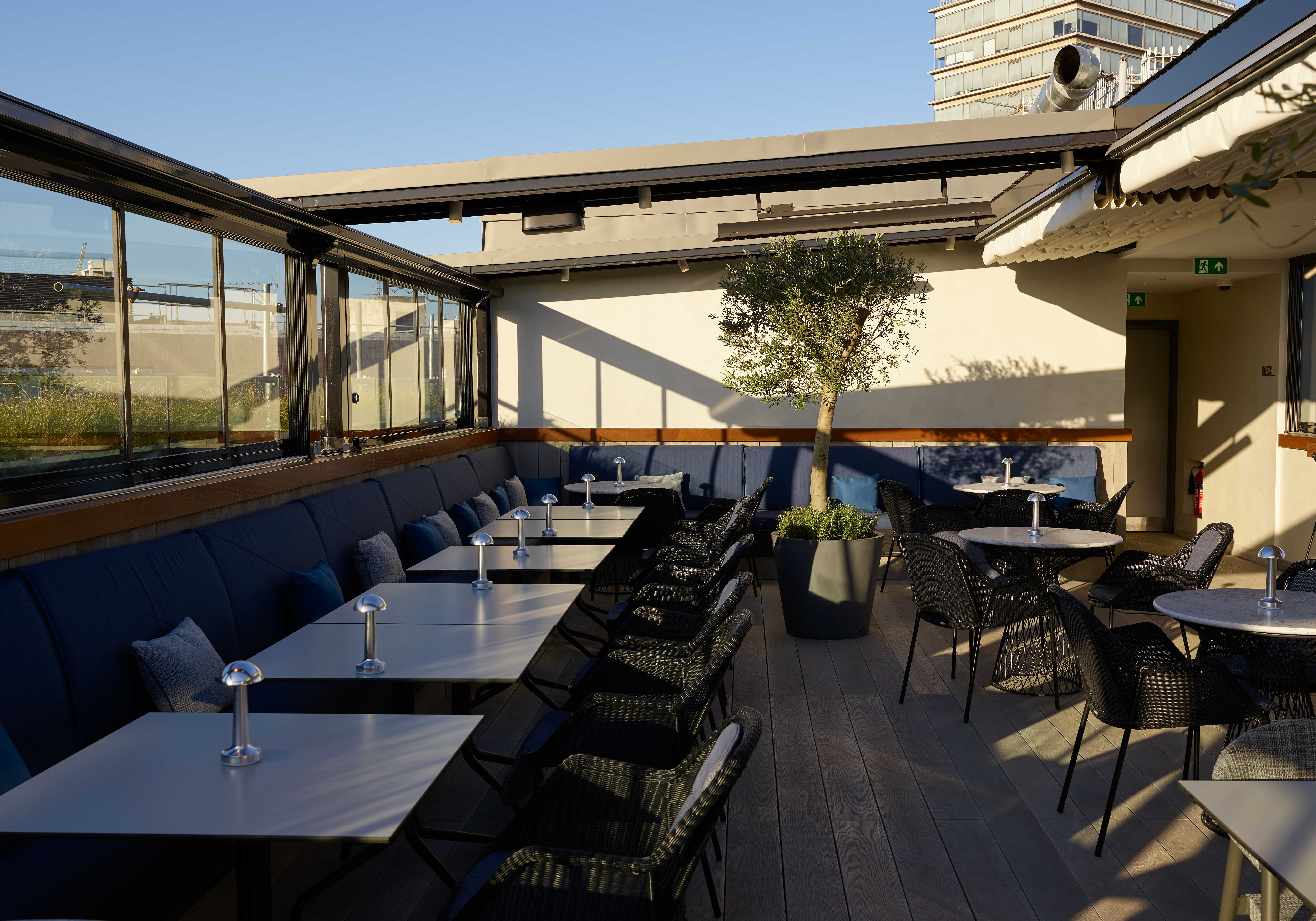 Rooftop restaurant private event dining area with open ceiling