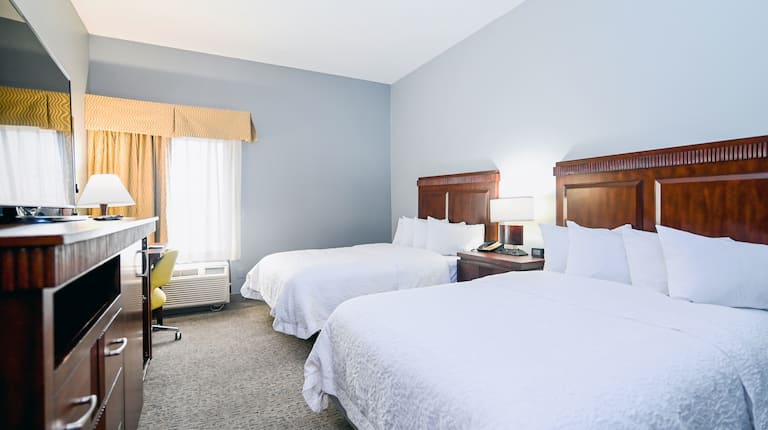 Two Queen Beds Guest Bedroom with TV and Work Desk