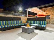 Outdoor Lounge at Night with Firepit