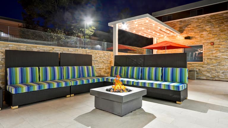 Outdoor Lounge at Night with Firepit
