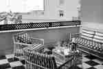 Guestroom Terrace With Lounge Seating and Table With View of the City