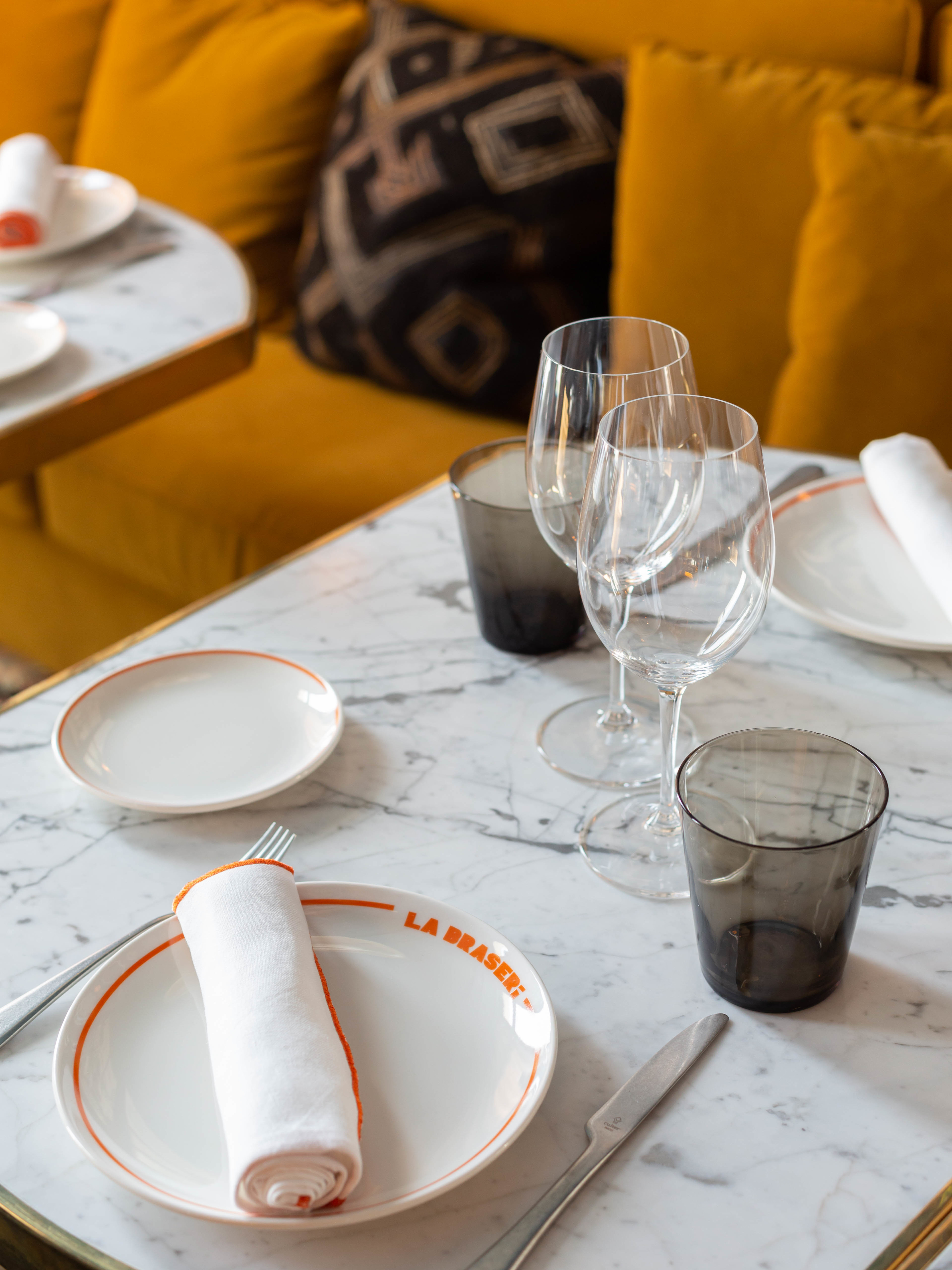 Restaurant table with glasses and crockery