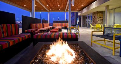 exterior patio with fire pit at dusk