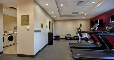 fitness center with exercise machines and guest laundry