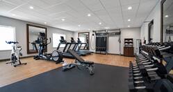 fitness center with various weights and machines