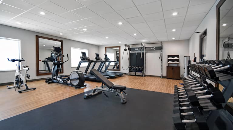 fitness center with various weights and machines
