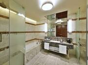 Grand Premier Suite Bathroom with Bathtub and Walk-In Shower