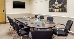 DoubleTree Manchester Airport Dulles Boardroom with Table, Chairs, and Room Technology