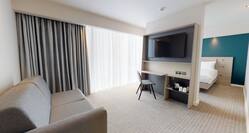 Queen Room With City View Sofa And TV