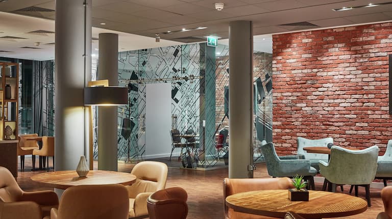Lounge Area with Exposed Brick and Modern Decor for a Unique Conference Experience