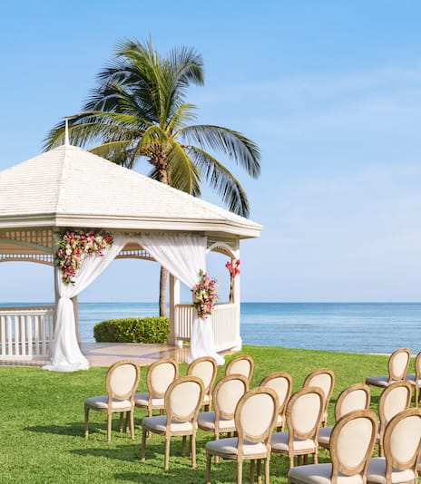 Garden overlooking ocean setup for wedding ceremony