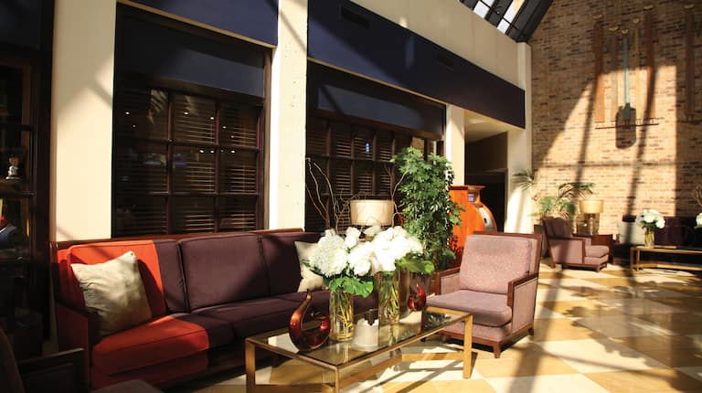 Lobby Seating Area with Sofa, Glass Coffee Table and Armchair