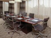 a meeting table and chairs in a room