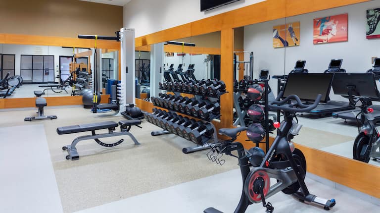on site fitness center, Peloton bike, free weights, weight bench