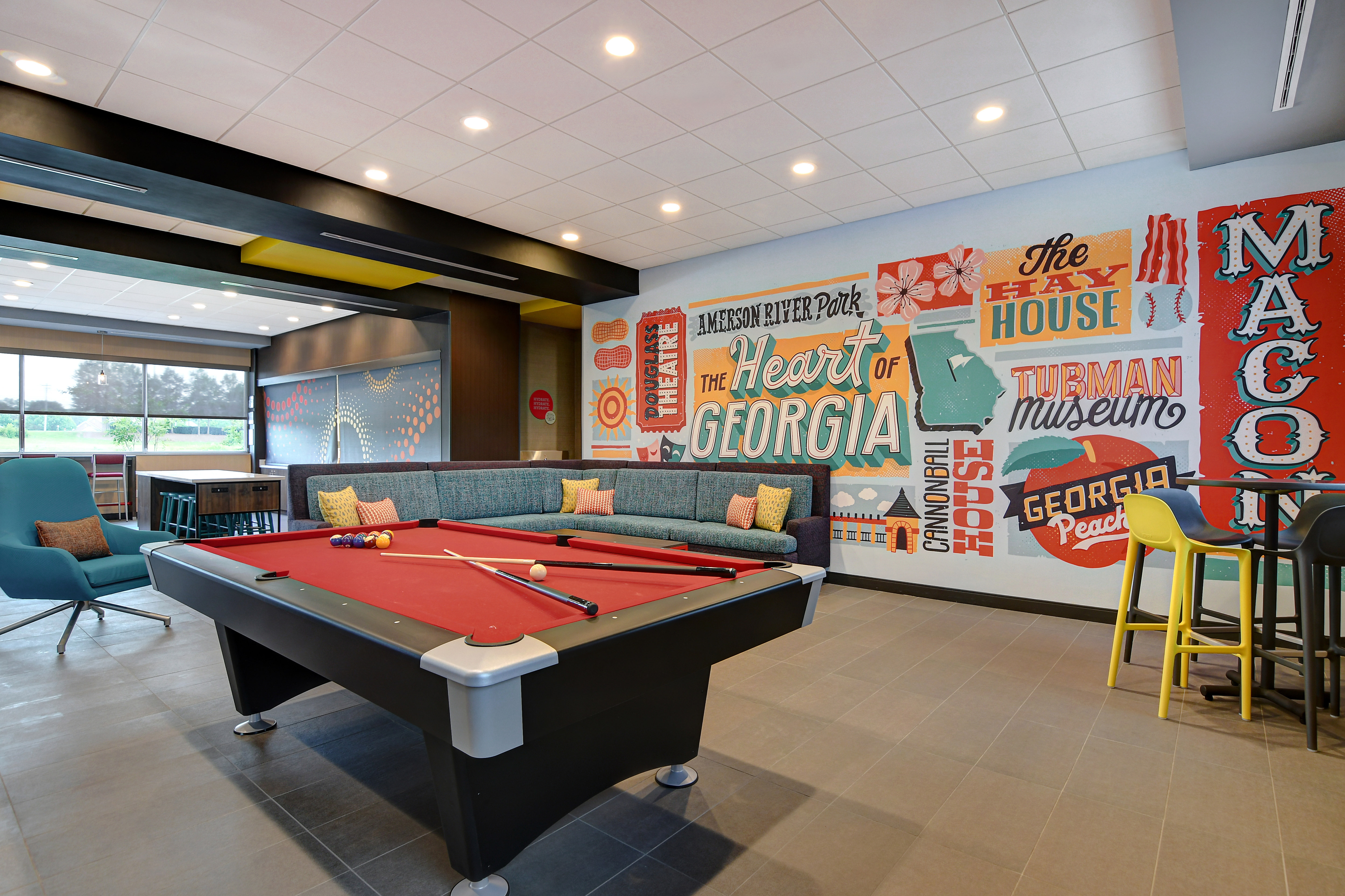 lobby pool table with mural