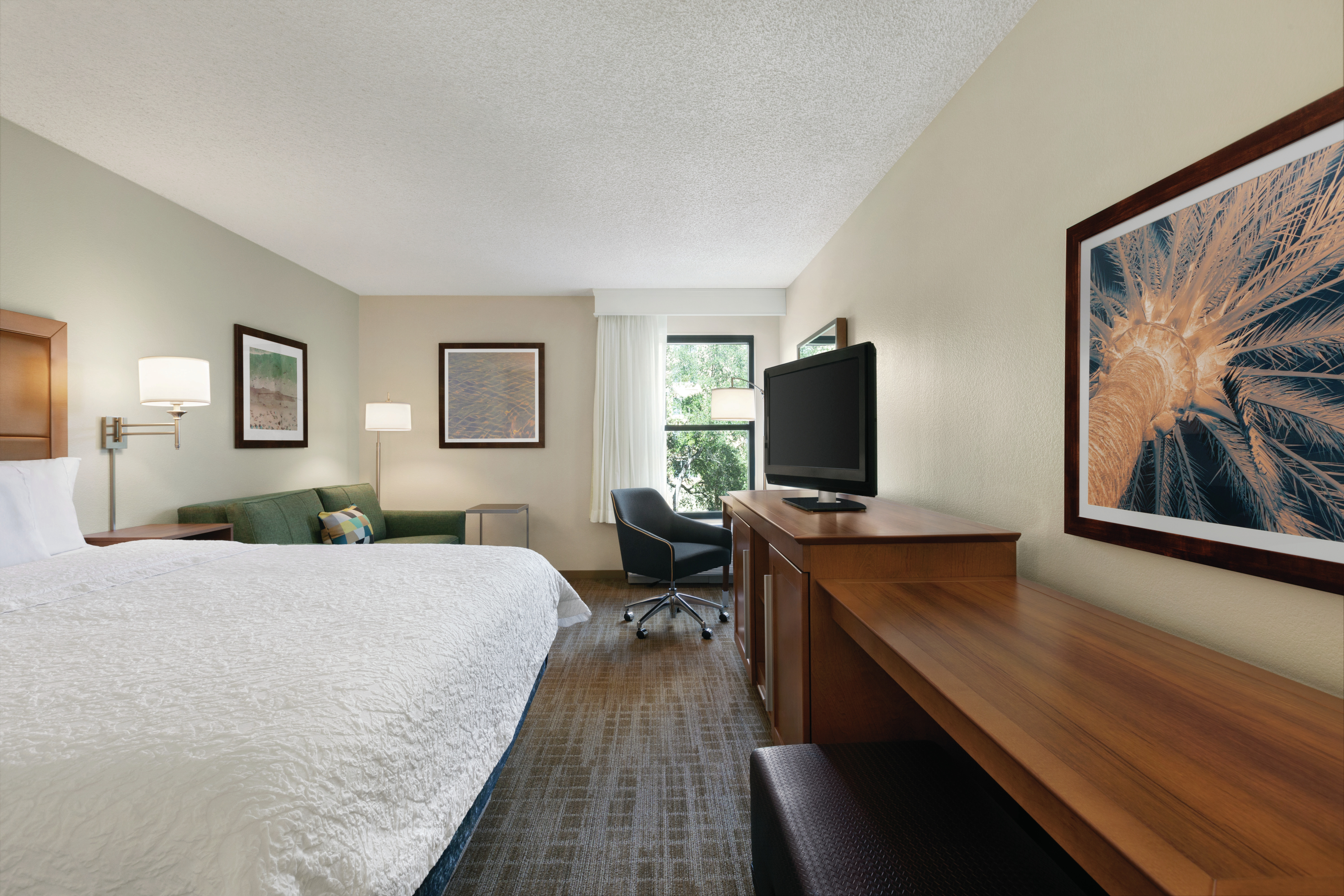 King Guestroom with Bed, Lounge Area, Work Desk, and Room Technology