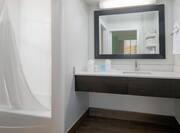 Vanity and Bathtub in Suite Bathroom