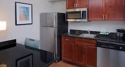 Guest Kitchen Area with Refrigerator and Dishwasher