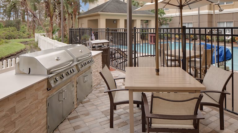 Outdoor Patio with BBQ Grills, Table and Chairs