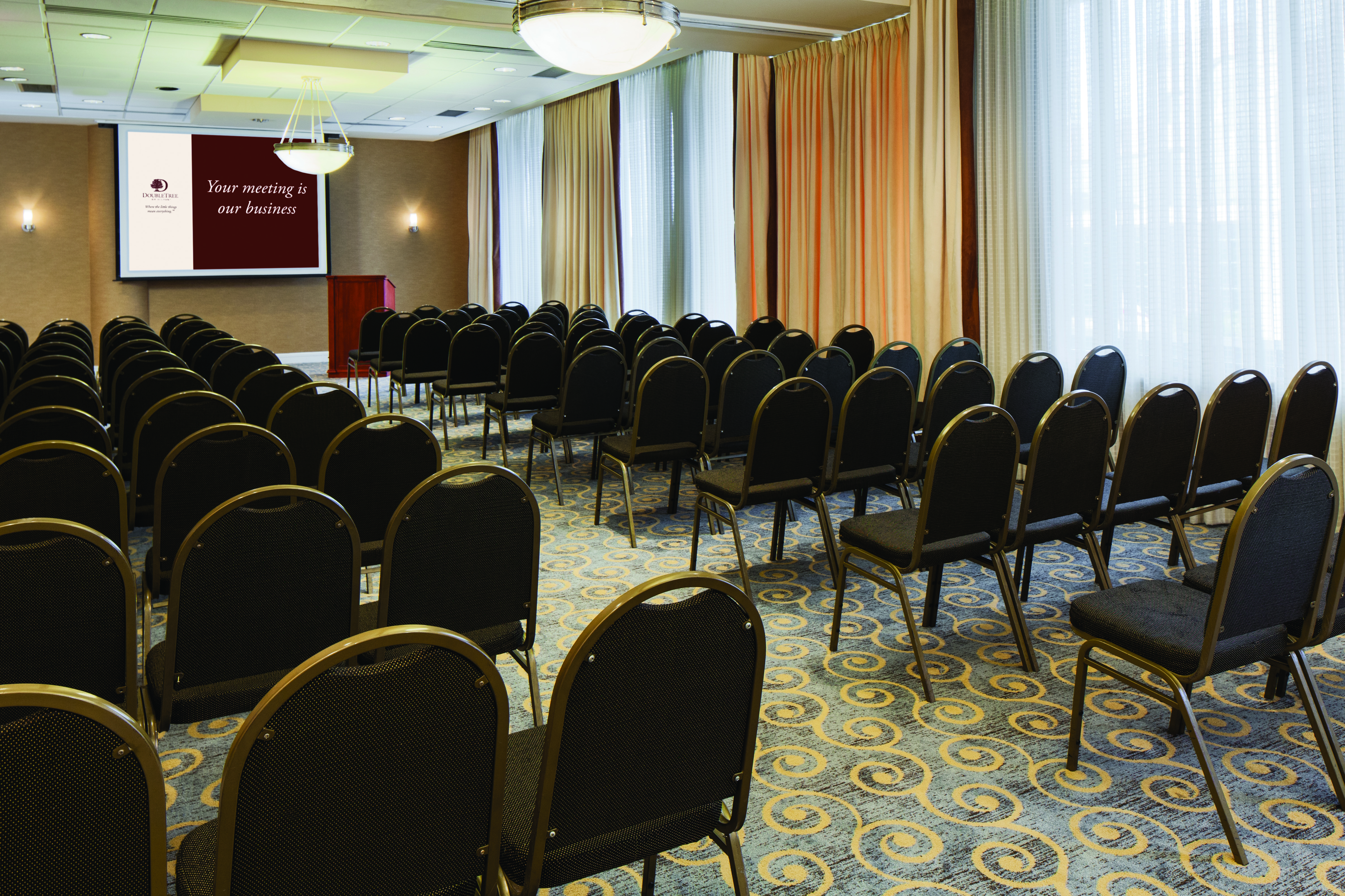 DoubleTree Hotel Meeting Room with Chairs and Projector Screen