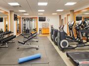 Fitness Center with Ellipticals, Weights, Dumbbells, and Room Technology